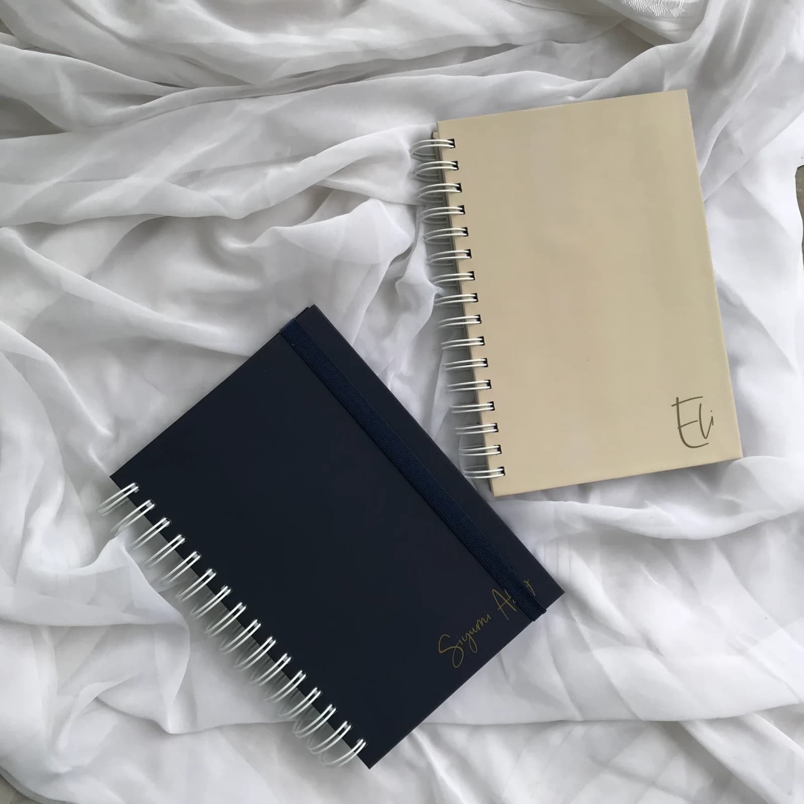 Corporate Branded Planner Collection photographed on softly styled fabric